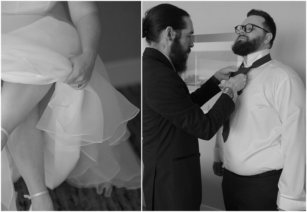 A groomsman helps a groom tie his necktie before a Milwaukee wedding.