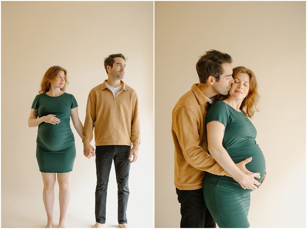 A man and woman hold hands in a Milwaukee photography studio during a maternity session.