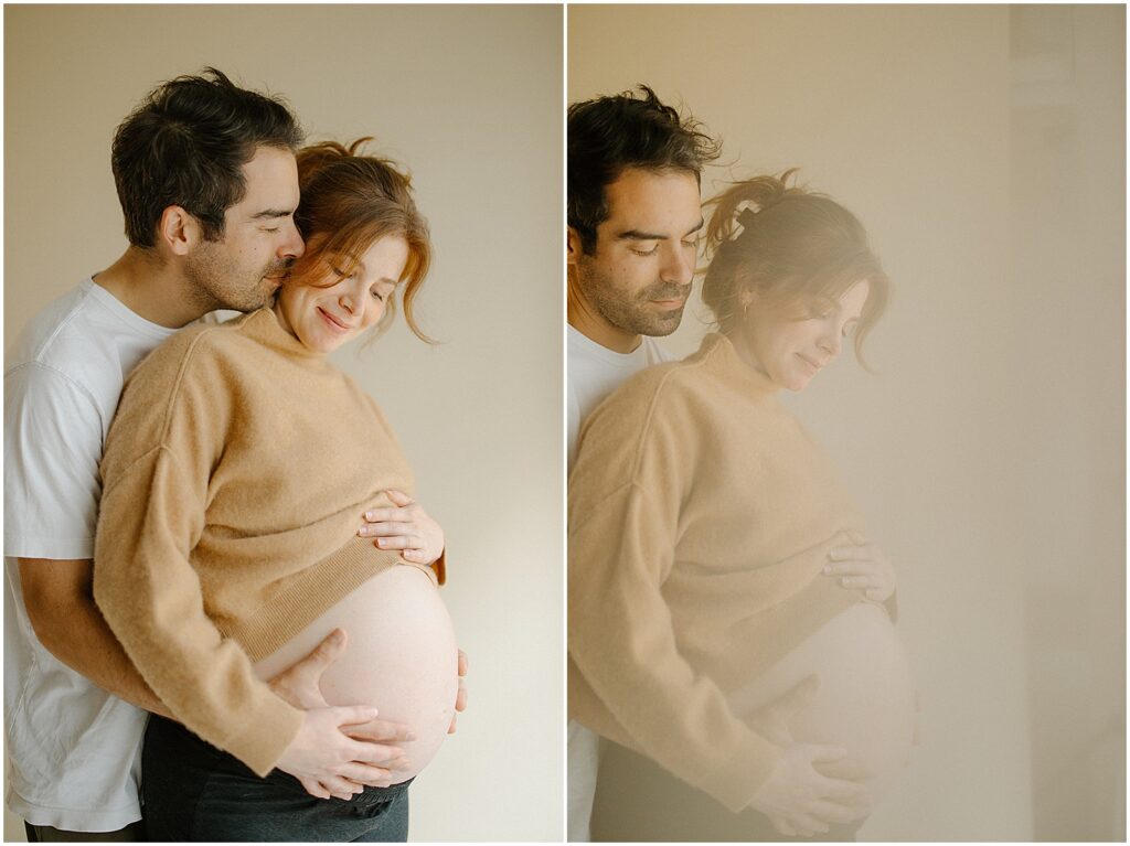 A man kisses his wife's cheek in a Milwaukee maternity photo session.