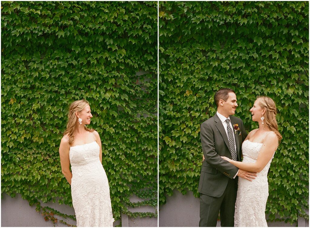 A bride and groom pose in front of a vine-covered wall outside a wedding venue in Milwaukee.