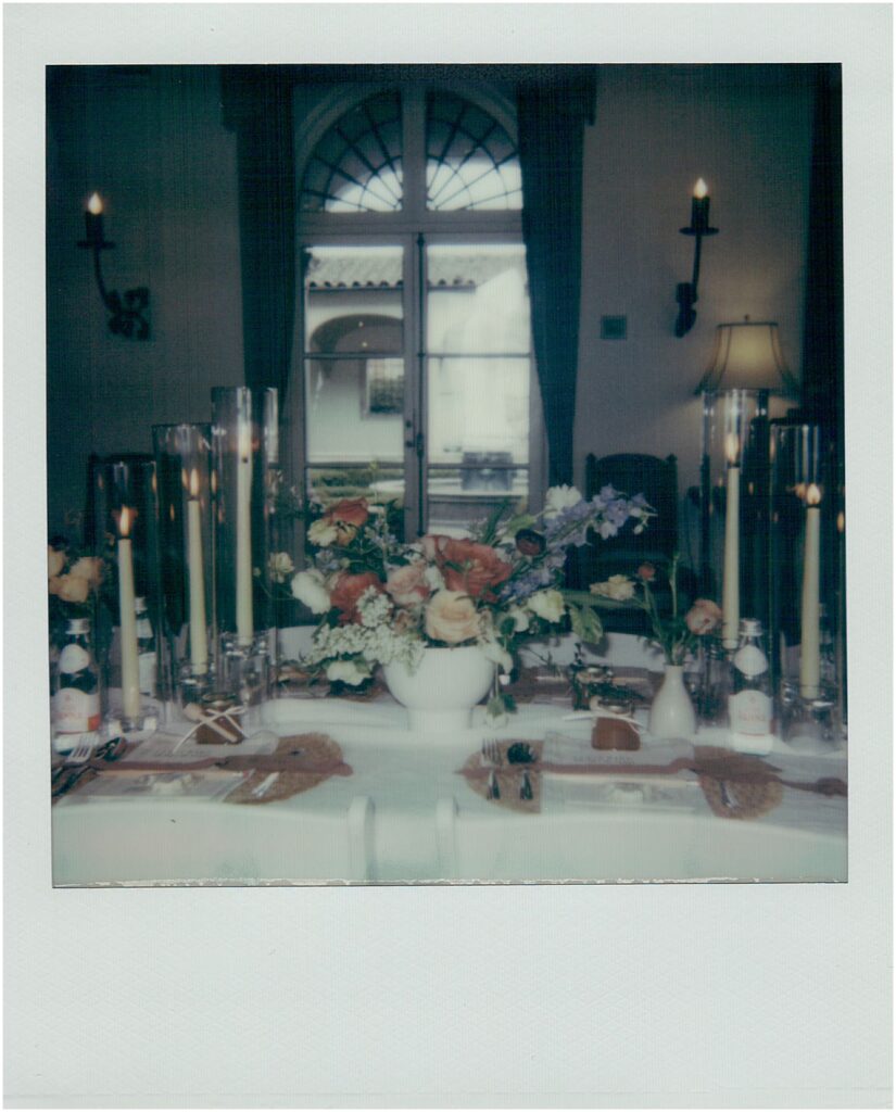 Candles and flowers decorate a reception table at a Milwaukee wedding venue.