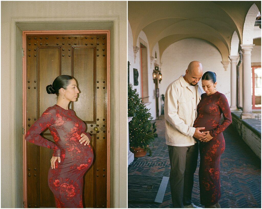 A couple stands on a covered walkway in a film maternity photo.