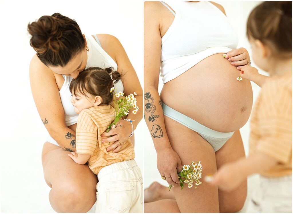 A pregnant woman kneels to embrace her toddler in a Milwaukee family photography session.