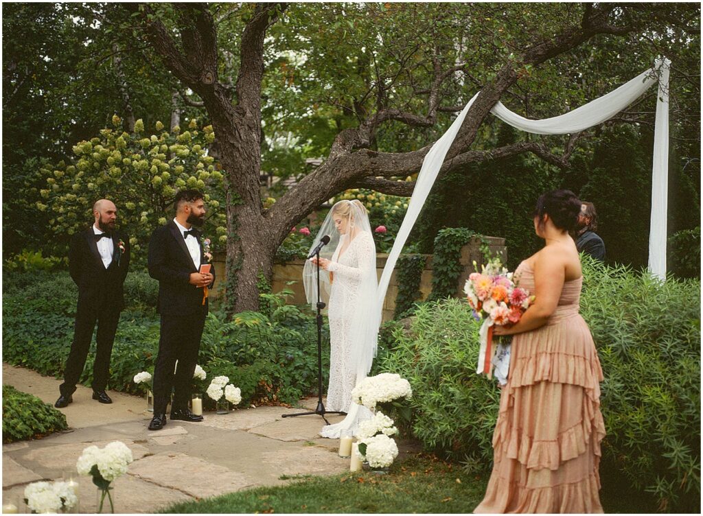 A bride reads her vows at an outdoor wedding venue in Wisconsin.