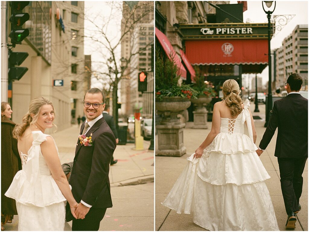 A bride and groom hold hands walking towards the Pfister Hotel in Milwaukee.