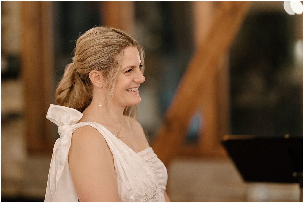 A Milwaukee bride smiles during her wedding ceremony.