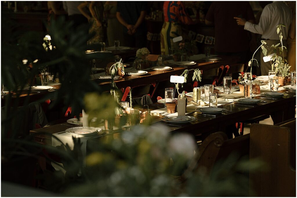 Sun shines on a wedding reception table inside Enlightened Brewing Company.