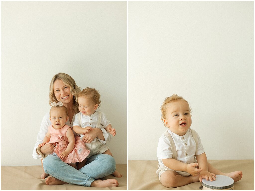 A mom holds her twins for a first birthday photoshoot.