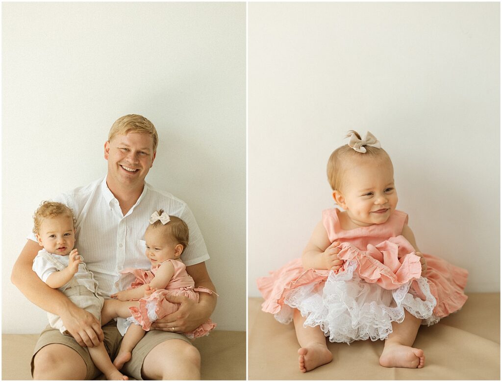 A father holds her twin babies for their first birthday photoshoot.