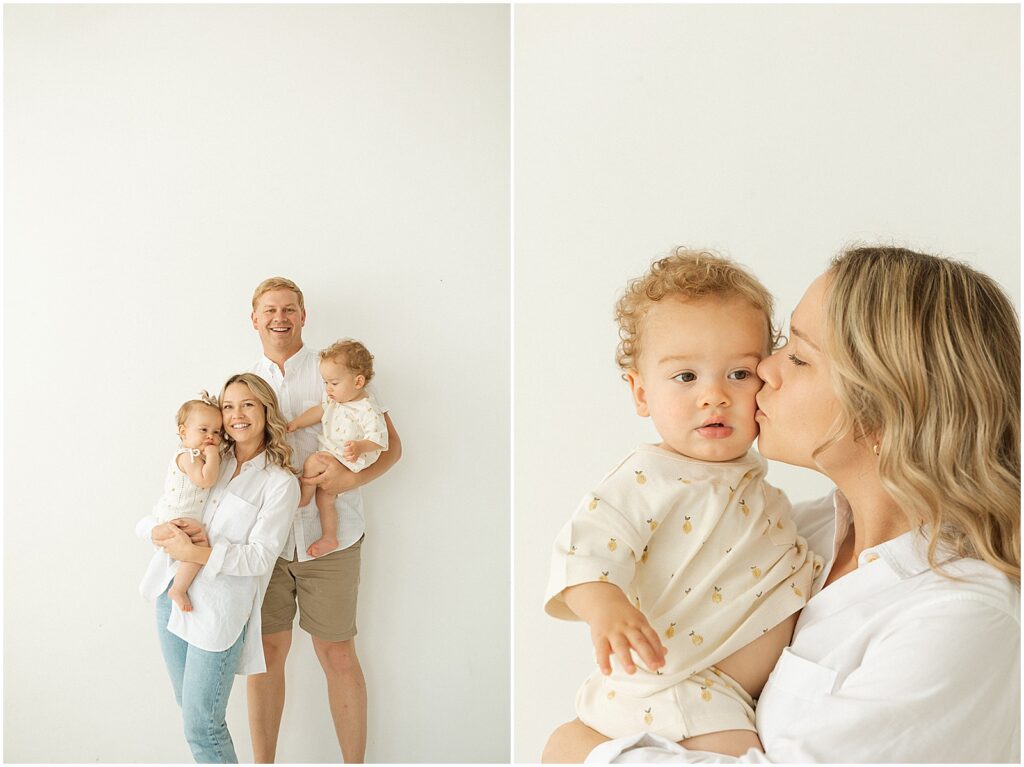 A mother kisses her baby's cheek in a Milwaukee photography studio.