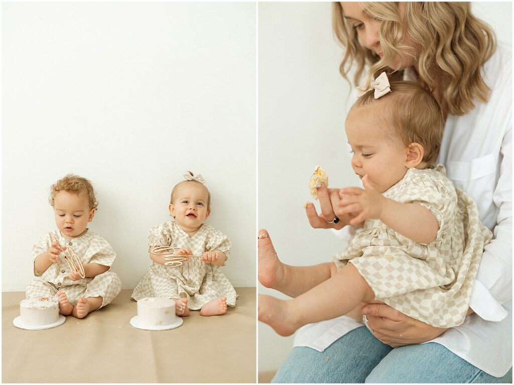 Twin babies smile and eat birthday cake.