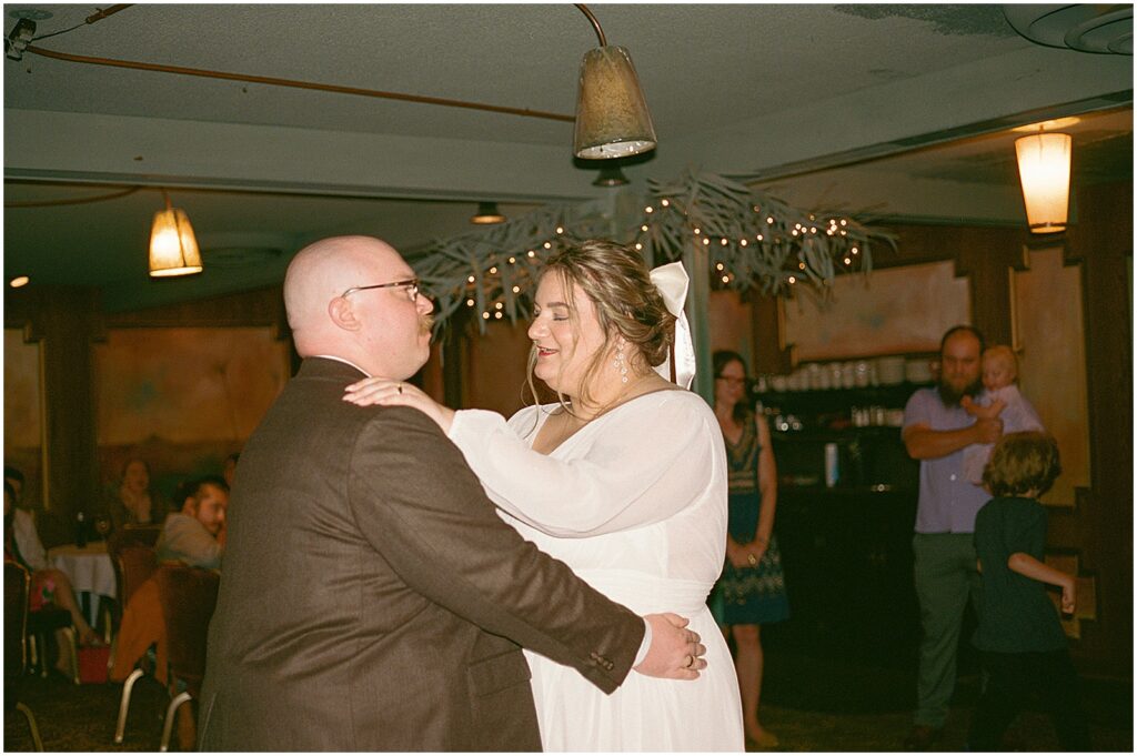 A bride and groom share a first dance at the Hobnob Restaurant.