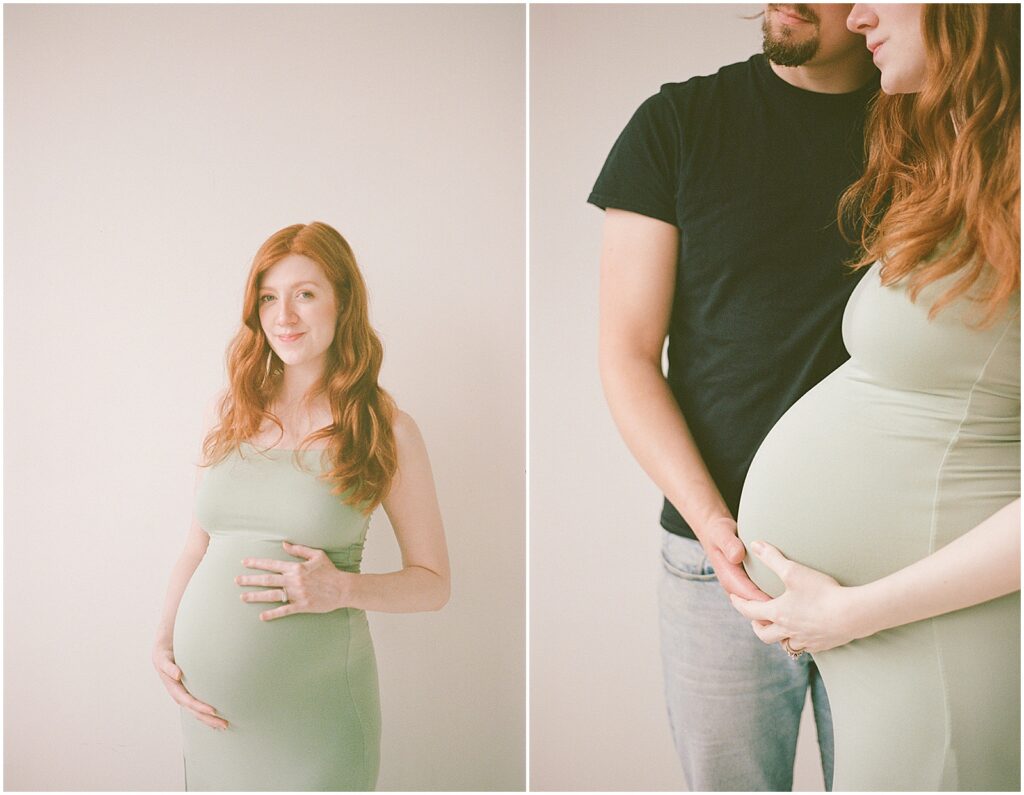 A pregnant woman poses for a Milwaukee maternity photographer in front of a white studio backdrop.