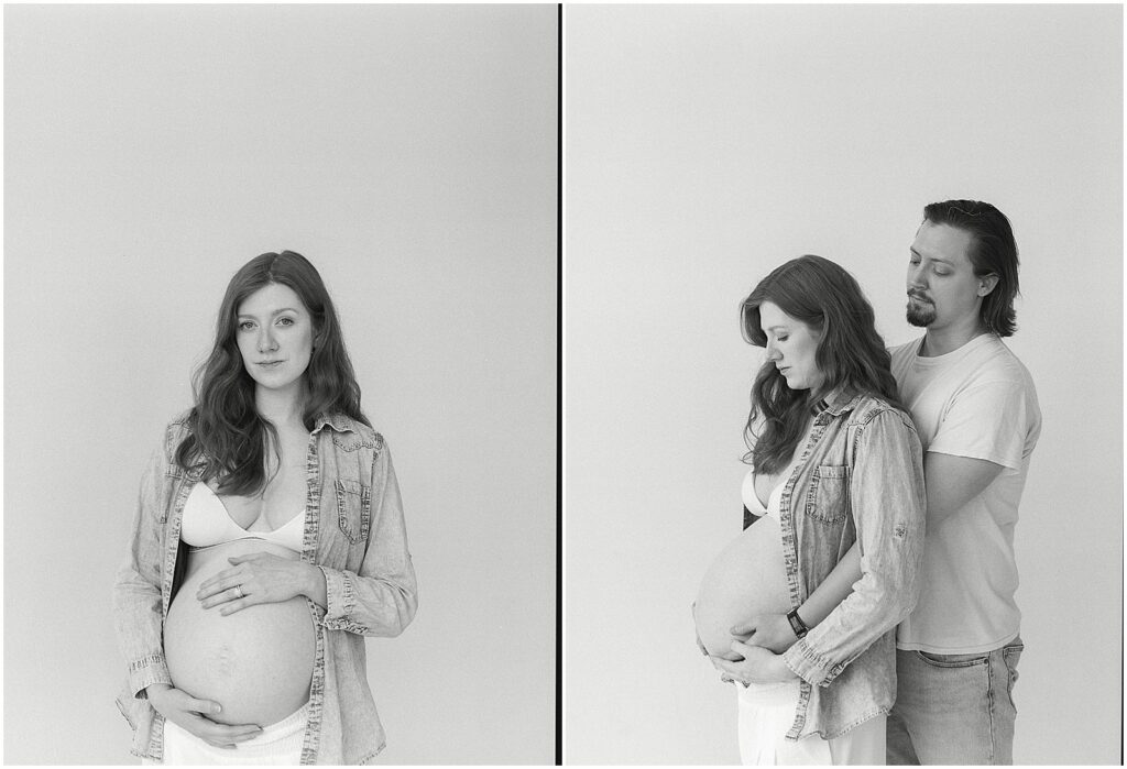 A woman poses in front of a studio backdrop for a maternity photo on film.