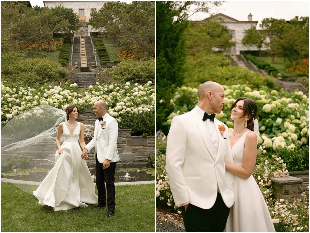 A bride and groom walk towards a Milwaukee wedding photographer in a historic garden wedding venue.