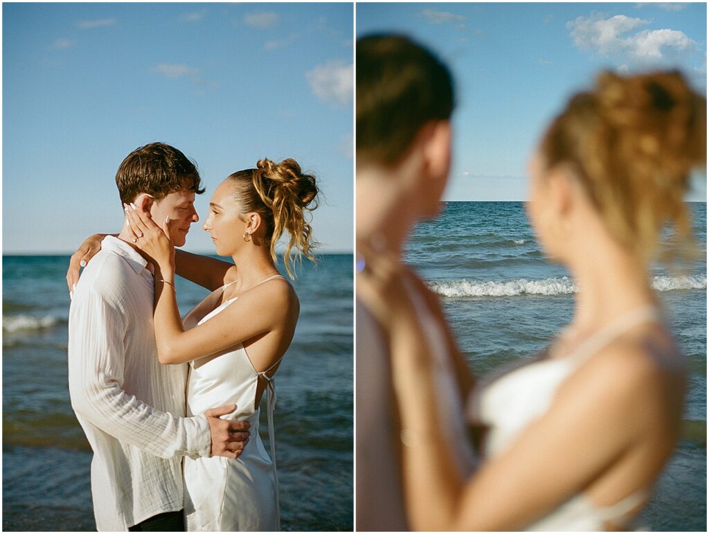 A bride and groom look out at Lake Michigan on a sunny afternoon.