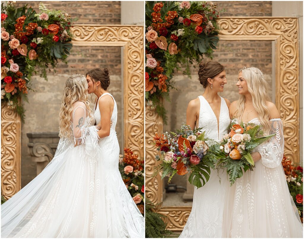 Two brides pose under a floral ceremony arch for a Midwest wedding photographer.