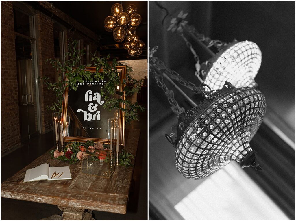 A wedding guest book sits on a wooden table surrounded by flowers.