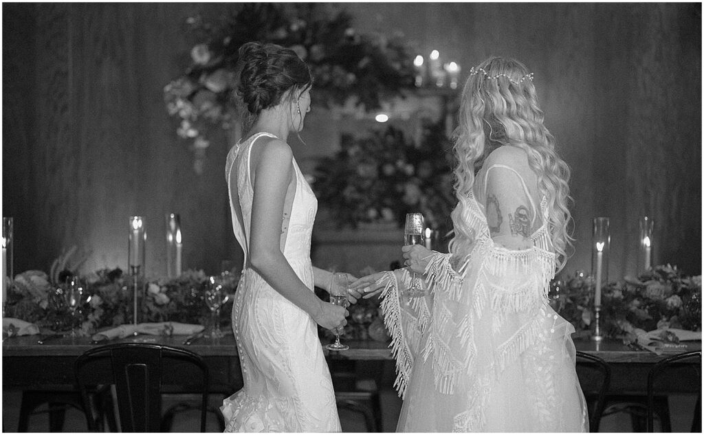 Two brides take a first look at their wedding reception venue in Chicago.