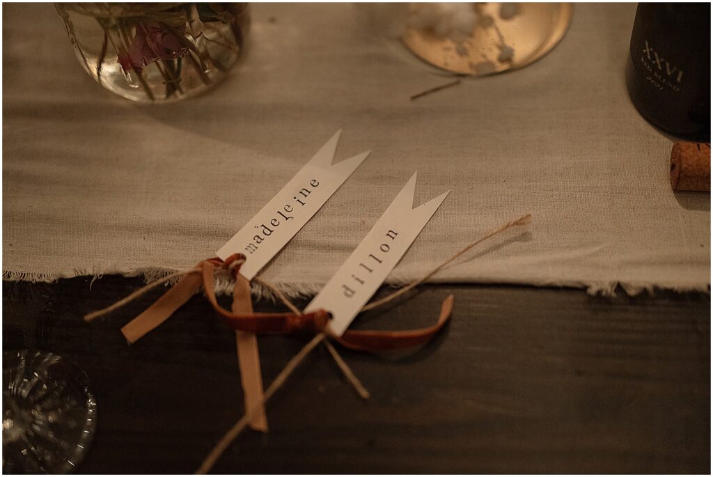 Name cards sit on a reception table.