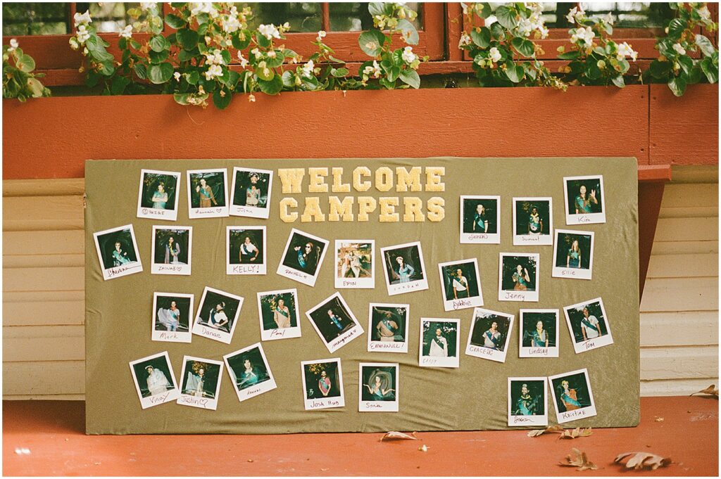Polaroid photos hang on a party welcome banner.