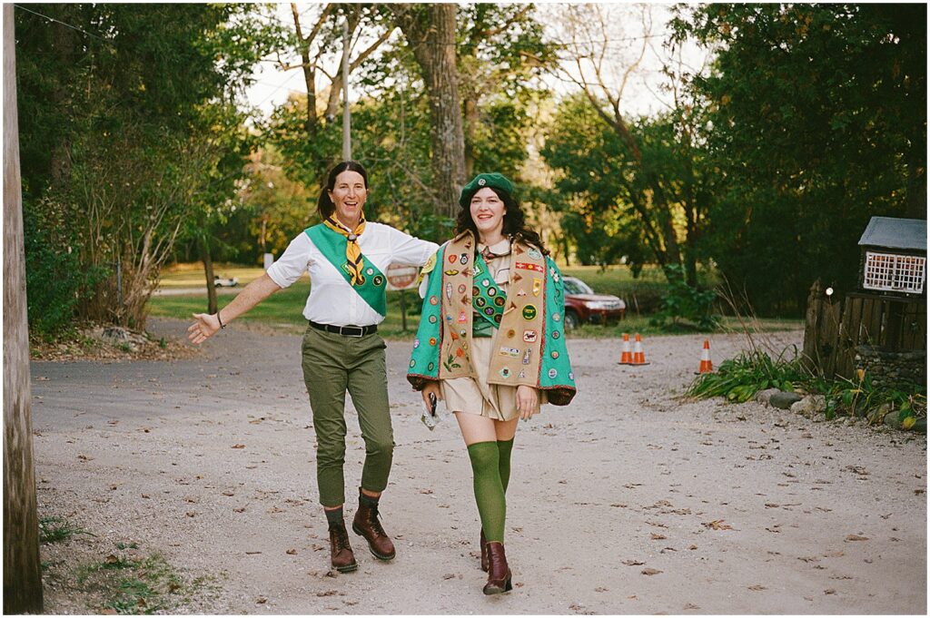 Two people in scout costumes walk towards a Milwaukee film photographer.