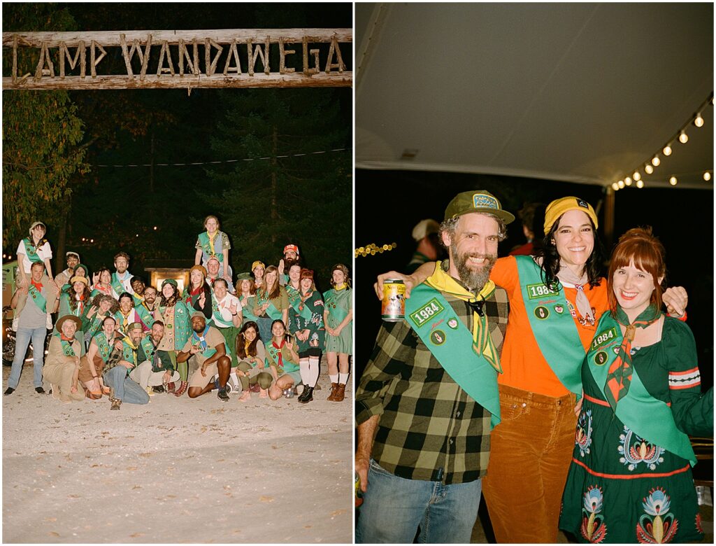 A group of people in scout costumes pose for a photo at Camp Wandawega at night.