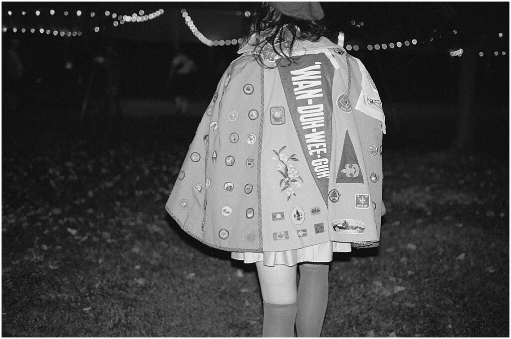 A woman walks away from a Milwaukee film photographer in a tent.